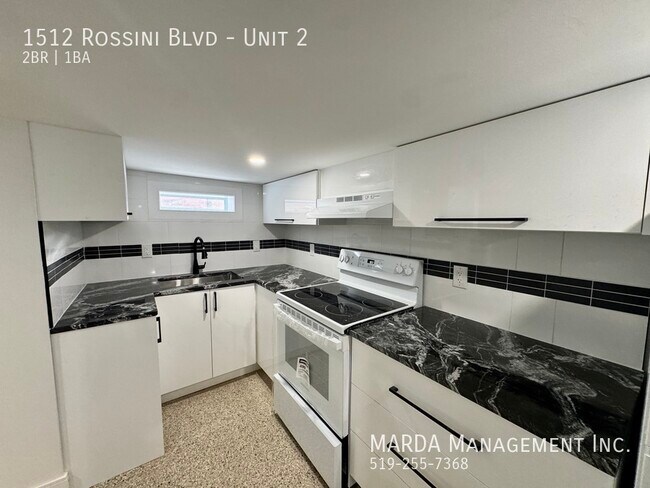 Photo du bâtiment - FULLY RENOVATED 2 BED/1 BATH LOWER UNIT- INCLUSIVE W/ $150 CAP