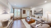 Located at 9100 Summit Ridge in Fort Worth, TX, this 2-bedroom, 2-bathroom single-floor residence offers a thoughtfully designed open-concept layout that seamlessly connects the living, dining, and kitchen areas. The living room features warm wood-look flooring, large windows with abundant natural light, and a welcoming atmosphere ideal for both relaxing and entertaining. The kitchen is a standout feature, showcasing rich dark-toned cabinetry, granite countertops, a subway tile backsplash, stainless steel appliances, and pendant lighting that adds a modern touch. The primary bedroom is generously sized, with plush carpet, large windows overlooking green outdoor views, and direct access to a dedicated closet with full-length hanging storage. The primary bathroom features a dual-sink vanity with granite countertops, dark cabinetry, and stylish black fixtures. The second bedroom is equally comfortable, with a ceiling fan and its own adjacent bathroom complete with a tub-shower combo and modern finishes. A dedicated laundry area houses a full-size washer and dryer. Throughout the space, neutral tones, recessed lighting, and consistent finishes create a cohesive, contemporary ambiance.