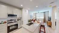 Located at 1610 Campbell Road in Houston's 77055 zip code, this one-bedroom, one-bathroom residence offers a thoughtfully designed open-concept floor plan with modern finishes throughout. Light wood-tone flooring flows seamlessly across the living, kitchen, and dining areas, creating a cohesive and airy atmosphere.

The kitchen is a standout feature, equipped with stainless steel appliances including a French door refrigerator, electric range, and built-in microwave. White shaker-style cabinetry with ample storage reaches toward the ceiling, complemented by a classic subway tile backsplash and granite countertops. A central island with an undermount sink and additional seating serves as both a functional workspace and a casual dining area.

The living room offers a comfortable, well-lit space with a ceiling fan, large window with natural light, and neutral tones that create a relaxing ambiance. The bedroom features a ceiling fan, a generously sized window, and a dedicated closet for organized storage. The bathroom mirrors the home's refined aesthetic with granite countertops, gray cabinetry, an undermount sink, and a marble-tiled shower enclosure. Recessed lighting throughout enhances the clean, contemporary feel of this well-designed residence.