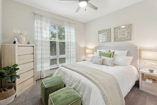 Bright bedroom with large window - Highline Apartments