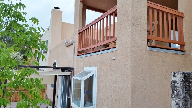 This is the backyard looking up at the balcony deck. - 6436 Saint Josephs Ave NW