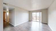Located in Waco, TX, this single-story, 2-bedroom, 2-bathroom unit offers a practical and comfortable layout designed to maximize everyday livability. The living room serves as the heart of the home, featuring durable wood-look flooring, neutral-toned walls, a textured ceiling, and a sliding glass door that fills the space with natural light while providing direct access to an outdoor area. An adjacent dining room connects seamlessly to the kitchen, which is outfitted with white cabinetry, dark granite countertops, and built-in appliances, including a dishwasher and refrigerator. A tall pantry cabinet adds convenient storage. The two bedrooms continue the wood-look flooring theme and are finished with neutral walls and window blinds that allow for natural light control. The primary bedroom offers a comfortable footprint, while both bedrooms provide a quiet, functional retreat. The two bathrooms are cleanly finished with tub-shower combos, white cabinetry, and wood-look flooring. A hallway connects the key areas of the unit, contributing to an efficient and well-organized floor plan. Overall, the unit presents a clean, move-in-ready aesthetic throughout.