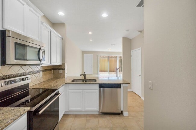 Building Photo - Beautiful 3/3/2 in Gated Amenity Rich Vill...