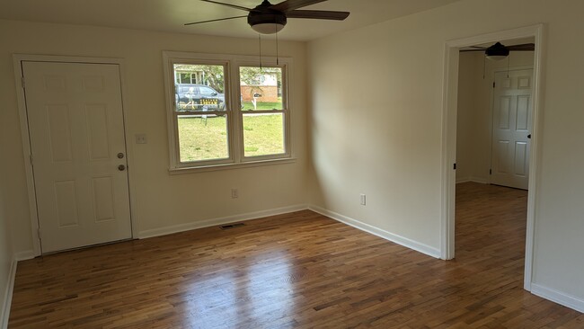 Living area with front door and connected to bedroom 1 - 36 Montis Dr