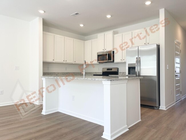 Building Photo - Move In by April 30 & Save $200/Month! Townhome Only $1,695! Regular $1,950 — Available NOW