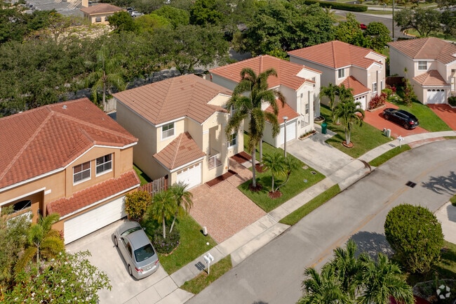 Captivating Spanish Eclectic Townhomes Amidst Beautiful Landscapes in Oriole Neighborhood, Margate, FL.