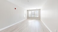 This contemporary 1290 square foot apartment offers a harmonious blend of style and functionality. The single-floor layout encompasses three bedrooms, including a generous 200 square foot primary bedroom, and two well-appointed bathrooms. The heart of the home is the open-concept kitchen and living area, showcasing a gourmet kitchen with sleek wooden cabinetry, stainless steel appliances, and a substantial granite-topped island. The kitchen's white subway tile backsplash and pendant lighting add a touch of elegance.

Throughout the apartment, light wood-look flooring creates a bright, airy atmosphere, complemented by large windows that flood the rooms with natural light. The bedrooms feature plush carpeting and ceiling fans for comfort. Both bathrooms boast modern fixtures, including glass-enclosed showers, granite countertops, and ample storage.

The neutral color palette, recessed lighting, and high ceilings contribute to the overall sense of spaciousness. Additional amenities include a pantry for extra storage and energy-efficient appliances. The property's location at 71 Boston Rd in Billerica, MA, offers convenient access to local amenities. This thoughtfully designed apartment combines contemporary aesthetics with practical living spaces, making it an ideal home for modern living.