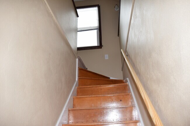 Hardwood stairs to upstairs - 423 32nd St NE
