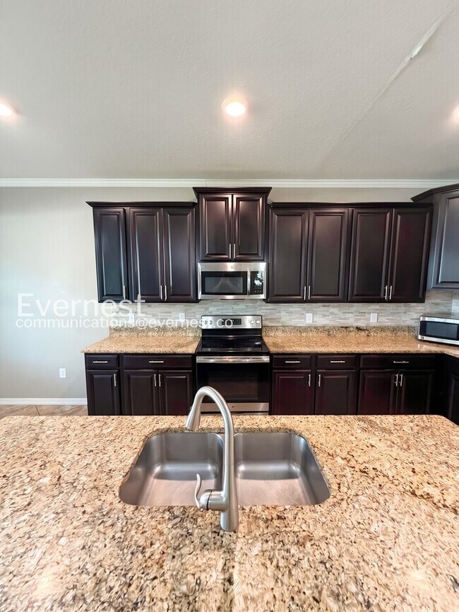 Building Photo - 4 Bed & 3 Bath Home with Fenced Yard and Modern Amenities / Voucher Accepted / No Pets Allowed / ...