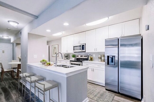 Building Photo - Spacious 2-Bedroom Elite Apartment with Private Balconies & Washer/Dryer