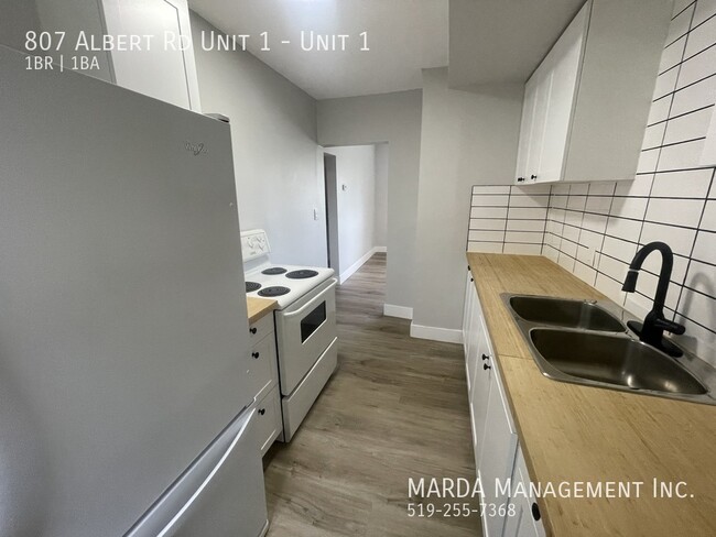 Photo du bâtiment - COZY 1-BEDROOM/1BATH MAIN FLOOR APARTMENT ...