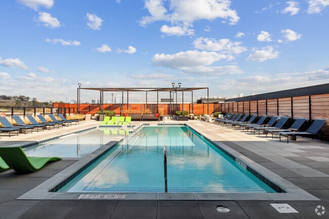 Soak up the sun and skyline views at our rooftop oasis. - Residences at The Finery