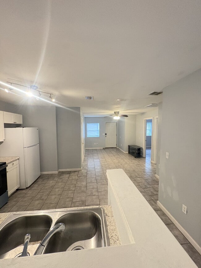 Building Photo - Open floor plan, four-bedroom two-bathroom with washer and dryer