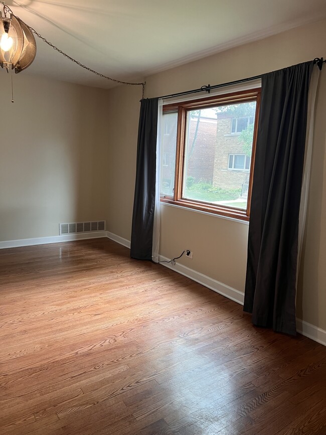 Living room with large picture window - 8041 Lake St