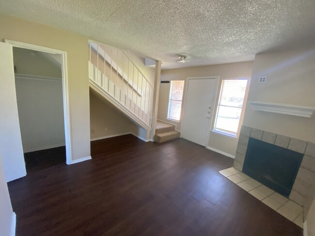 Living room, winter closet and fireplace - 10659 Starcrest Dr