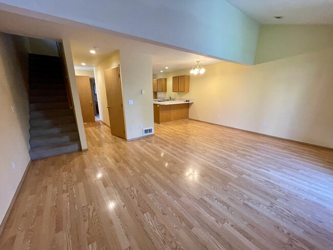 L to R: Stairs to bedrooms, hall w/2 closets to front door, kitchen, dining/living area - 290 NW Clay Ct