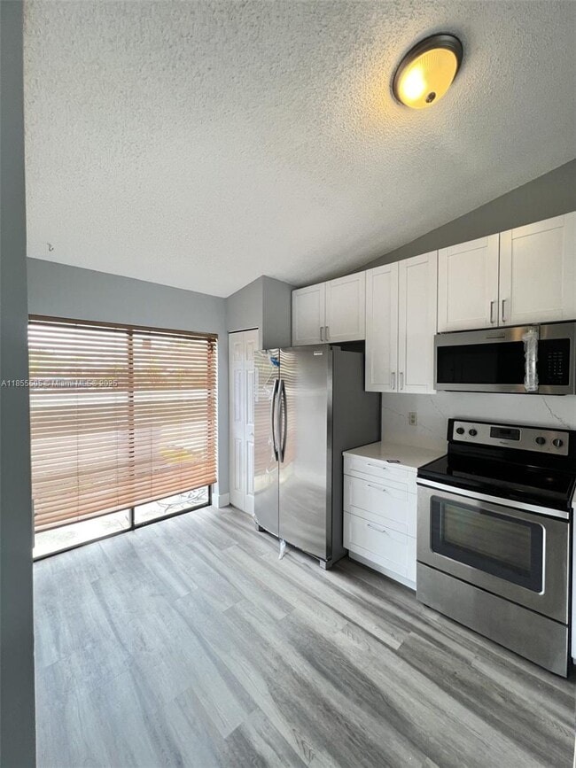 Building Photo - 10155 Boca Bend E