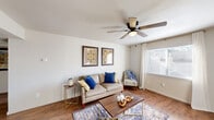 Located in Columbia, SC, this one-bedroom, one-bathroom residence offers a practical and comfortable single-floor layout designed to maximize every square foot. Warm hardwood-style flooring flows consistently throughout the home, creating a cohesive and inviting atmosphere.

The living room is a bright, welcoming space featuring a ceiling fan with light kit and a large window dressed with sheer curtains that allow natural light to fill the room. Adjacent to the living room, the separate dining area provides a clean, open space ideal for everyday meals. The galley-style kitchen is equipped with dark espresso cabinetry, light countertops, and black appliances including a range, microwave, and refrigerator, offering efficient use of space.

The spacious primary bedroom includes a ceiling fan, a sizable window with sheer curtain panels, and ample room for seating or additional furniture. A dedicated closet provides convenient storage. The bathroom features a single-sink vanity with dark cabinetry and a light countertop, a combination tub and shower, and hardwood-style flooring that continues from the rest of the home.

Throughout the residence, neutral wall tones, textured ceilings, and consistent flooring contribute to a clean and functional aesthetic well-suited for comfortable everyday living.