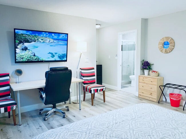 103 - 55" Smart TV with huge adjustable desk (outdated photo) - 1495 Kavanaugh Dr