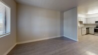 Located at 3434 E McDowell Rd in Phoenix, Arizona, this one-bedroom, one-bathroom residence offers a well-organized single-floor layout designed for comfortable everyday living. The open-concept kitchen and living area serves as the heart of the home, featuring white shaker-style cabinetry, granite-look countertops, and a full suite of stainless steel appliances including a refrigerator, range, microwave, and dishwasher. Light wood-style flooring runs throughout, lending a clean, cohesive look to the space. The living area provides ample room for furniture arrangement and benefits from natural light through window blinds. The bedroom is a comfortable, well-proportioned retreat with wood-style flooring, neutral wall tones, and a window that brings in natural light. It connects directly to a dedicated closet with built-in shelving, as well as convenient access to the hallway and bathroom. The bathroom is neatly appointed with a full tub-shower combination, wood-style flooring, and brushed nickel hardware accents. A hallway connects the main living spaces efficiently. Throughout the unit, crisp white trim and neutral gray walls create a clean, move-in-ready ambiance suited to a variety of personal styles.