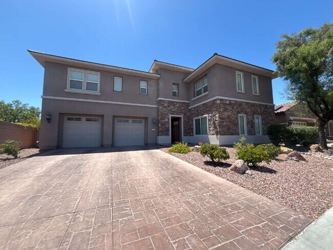 Foto del edificio - 5-Bed Retreat with Granite Elegance & Cozy Fireplace – 3690 Sq Ft of Comfort in Las Vegas with a ...