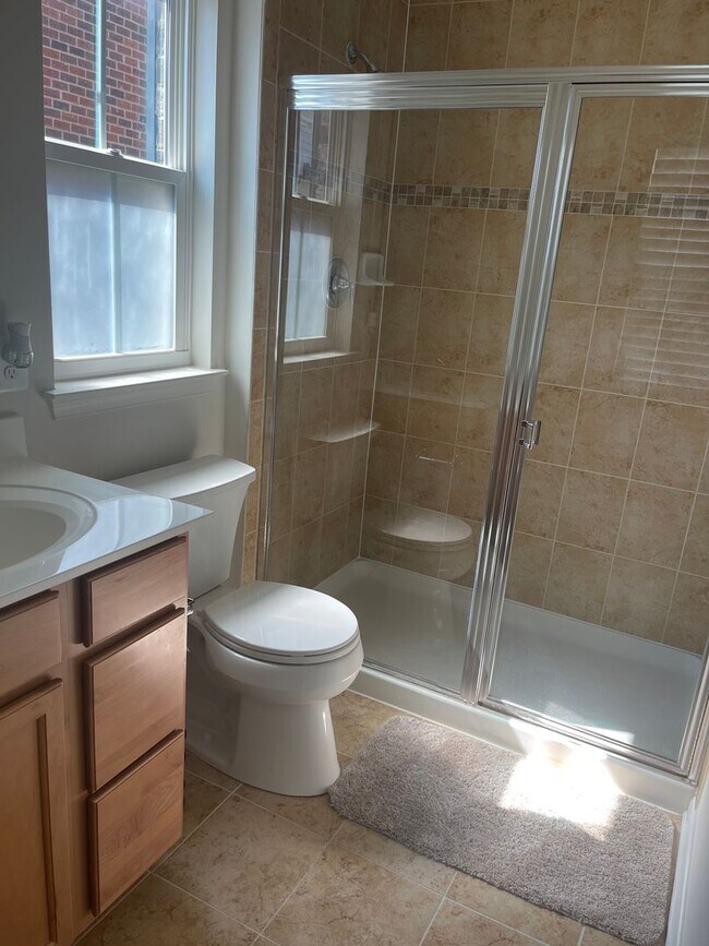 Building Photo - END UNIT TOWNHOUSE WITH 2 CAR GARAGE, WOOD...