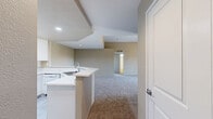 This 1110 square foot single-story residence in Chula Vista offers a blend of comfort and functionality. The home boasts five bedrooms, including a 170 square foot primary bedroom, and three bathrooms. The open floor plan combines the kitchen and living room, creating a spacious central gathering area. Vaulted ceilings in the main living space add a sense of grandeur and openness.

The kitchen features white cabinetry, a full suite of appliances including a built-in microwave, and a practical L-shaped layout. Light wood-look flooring in the kitchen and bathrooms contrasts nicely with the plush carpeting found in the bedrooms and living areas. 

Bathrooms are designed with convenience in mind, featuring white fixtures, ample counter space, and windows for natural light. The bedrooms are generously sized, with some including mirrored closet doors to maximize space.

A standout feature is the fireplace in one of the main living areas, paired with a sliding glass door that leads to an outdoor space, offering a seamless indoor-outdoor living experience. Ceiling fans throughout provide additional comfort.

Large windows in various rooms flood the space with natural light and offer pleasant views of the surrounding area. The neutral color palette throughout the home provides a blank canvas for personalization. This property combines functionality with modern amenities, making it an ideal family home or investment opportunity in the desirable Chula Vista area.