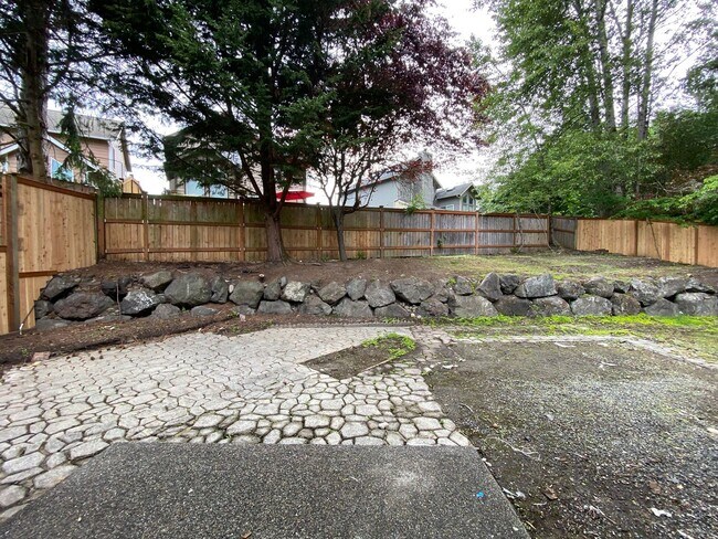 Building Photo - Stylishly Renovated Home with Private Back...