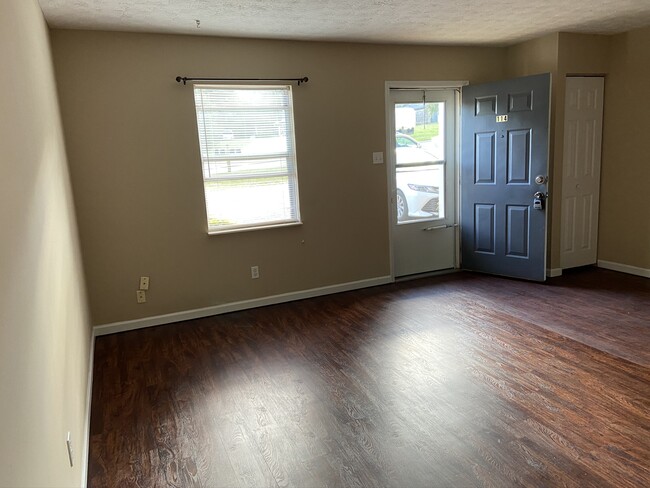 Living room looking toward front door - 114 Stonetree Drive