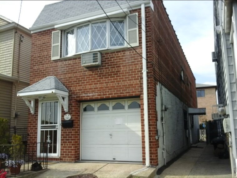 Two story detached brick house - 63-25 Borden Ave