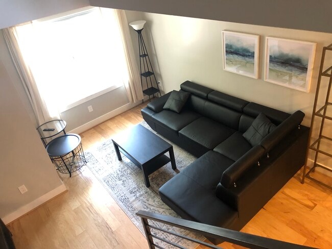 Living room (pull-out couch) leading to second floor - 614 I St NE