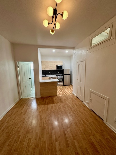 Dining room, fits a 6 top table and 2 bar stools, large storage closet too. Bathroom door to left - 2748 Walnut St