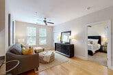 Located at 2200 Parklake Dr NE in Atlanta, Georgia, this well-appointed two-bedroom, two-bathroom residence offers a thoughtfully designed single-level layout. Warm hardwood flooring flows throughout the main living areas, complemented by neutral tones and abundant natural light streaming through multiple windows fitted with blinds.

The open-concept kitchen is a functional highlight, featuring rich wood cabinetry, dark granite countertops, and a full suite of stainless steel appliances including a range, microwave, dishwasher, and refrigerator. A peninsula with seating for three, illuminated by pendant lighting and track lights above, connects seamlessly to the dining and living areas — ideal for both entertaining and everyday living. Ceiling fans are present in the living room and bedrooms for added comfort.

Both bedrooms are carpeted and well-lit, with multiple windows offering outdoor views of surrounding greenery. The primary bedroom is generously sized with ample room for large furnishings. Four closets throughout the residence, including a walk-in with wire shelving, provide substantial storage.

The bathrooms are finished with tile flooring, granite-topped wood vanities, and a tub-shower combination. A dedicated utility room completes this functional and comfortable home.