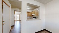 Located at 13960 Plymouth Ave in Burnsville, Minnesota, this two-story residence offers three bedrooms and three bathrooms across a thoughtfully organized floor plan. The main level serves as the social hub of the home, featuring a bright and open living room with hardwood-style flooring, a textured ceiling, and a pair of glass doors that invite natural light and provide outdoor access. The kitchen is positioned adjacent to the living area and is accessible via a convenient pass-through window, creating an open, connected feel. It is appointed with warm honey-toned wood cabinetry, light countertops, a double basin sink, and white appliances including a range and refrigerator. The upper floor hosts the three carpeted bedrooms, each offering a quiet, comfortable retreat with windows overlooking the surrounding neighborhood. The primary bedroom provides a generous amount of space. Three full bathrooms are distributed throughout the home, each featuring tile flooring, a tub-shower combination, and wood-toned vanity cabinetry. Additional practical features include four closets for ample storage, a dedicated laundry area, and two staircases connecting the floors. The home presents a functional and classic layout well-suited for everyday living.