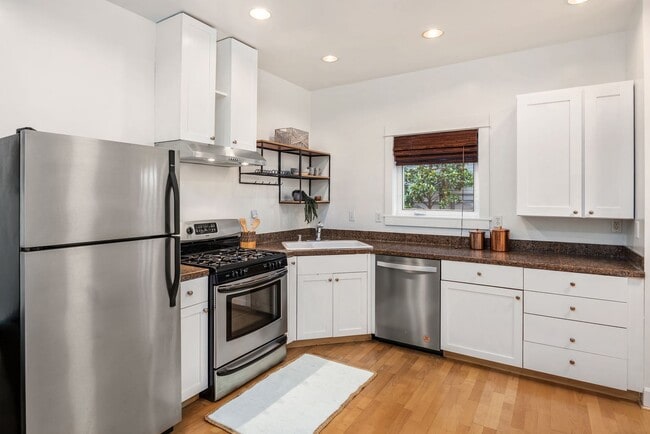 Building Photo - A Quiet Retreat with Parking, Patio, and City Proximity