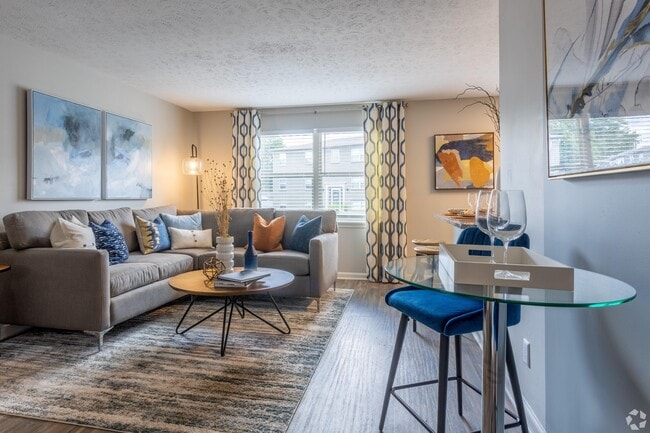 Spacious living room with hardwood-style flooring - Union at JTown