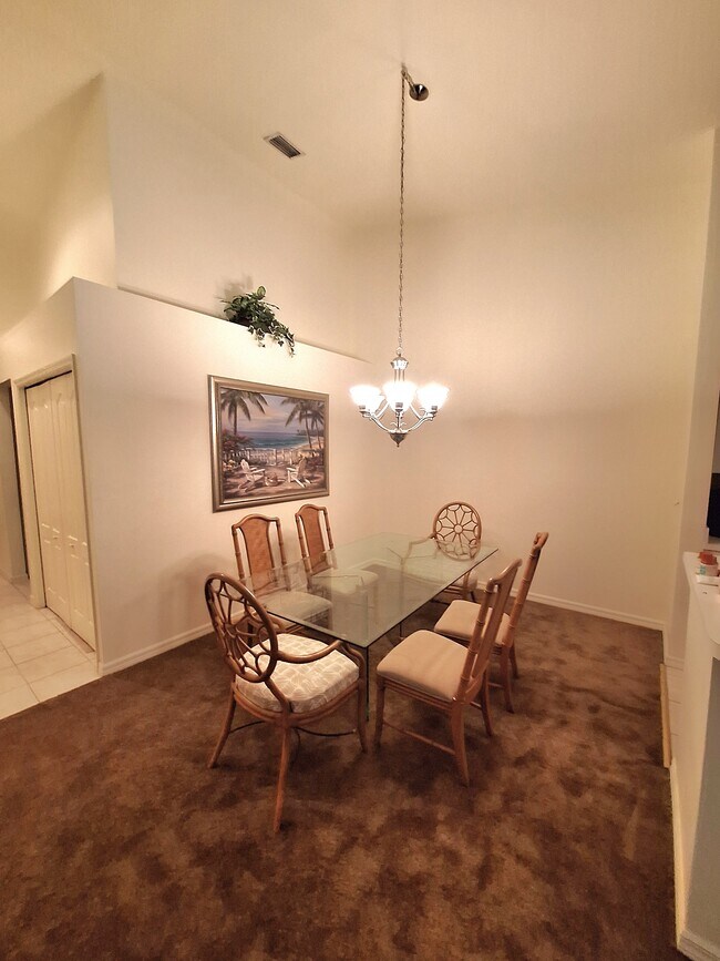Dining room light dims - 21301 Lancaster Run