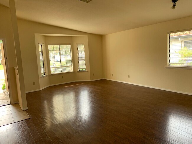 Building Photo - Just reduced! Well cared for home on the g...