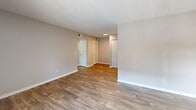 Located at 1100 Sunset Circle in Nashville, TN, this one-bedroom, one-bathroom unit offers a well-planned layout across a single floor. The living room serves as the heart of the space, featuring a classic wood-burning fireplace, durable wood-look flooring, and a sliding glass door that opens to a private balcony with outdoor views — filling the room with natural light. The kitchen is thoughtfully designed with crisp white shaker-style cabinetry, granite-look countertops, a stainless steel range with overhead ventilation, and a double-basin sink — all set atop matching wood-look flooring for a cohesive aesthetic. The bedroom offers a quieter retreat, finished with plush carpeting, a ceiling fan with integrated lighting, a window with blinds for natural light and privacy, and access to a dedicated closet. The bathroom is clean and functional, featuring granite-topped vanity, an updated single-handle faucet, a tub-shower combination, and neutral toned walls. A hallway connects the rooms with ease, contributing to the unit's efficient and comfortable flow. Neutral wall tones and consistent finishes throughout lend the space a move-in-ready, polished feel.