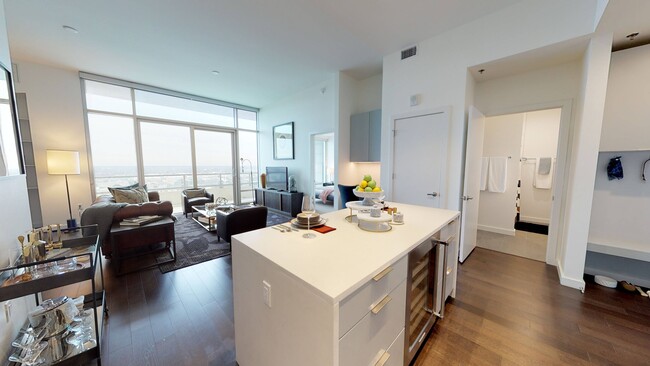 Kitchen island featuring storage and built in wine cooler - Ardan