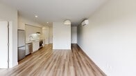 Located at 308 Rue Crevier in Saint-Laurent, Québec, this well-designed one-bedroom, one-bathroom unit offers a clean, contemporary aesthetic throughout. The open-concept layout seamlessly connects the living area to the kitchen, creating a spacious and functional flow. Light wood laminate flooring runs throughout the main living spaces, complementing the crisp white walls and lending a warm, modern feel to the interior.

The living area is bright and airy, featuring a wall-mounted mini-split heating and cooling unit for year-round comfort, along with a baseboard heater as a secondary heat source. The kitchen is fitted with white cabinetry, a stainless steel oven, and under-cabinet lighting, providing a practical and stylish cooking space.

The bedroom is a comfortable and quiet retreat, highlighted by a large window that frames views of the surrounding neighbourhood and allows ample natural light. A set of sliding closet doors provides built-in storage, keeping the space tidy and organized.

The bathroom is finished with large-format grey tile flooring and crisp white walls, creating a clean and modern atmosphere. It includes a full bathtub with a glass shower panel, recessed lighting, and a tall built-in storage cabinet for added convenience.

Overall, this unit offers a cohesive, minimalist design with quality finishes throughout, ideal for those seeking a functional and stylish living space in Saint-Laurent.