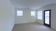 Located at 100 Reserve Ct in Grenville, NY, this single-floor residence offers a clean, move-in-ready layout with a light and airy aesthetic throughout. The interior is finished with neutral cream-toned walls that create a bright, welcoming atmosphere, complemented by wall-to-wall carpeting in a warm beige tone that adds comfort underfoot. Multiple windows fitted with white blinds allow generous natural light to fill the rooms, enhancing the open and spacious feel of the living areas. The design is characterized by its simplicity and functionality, with crisp white trim and baseboards providing a polished, cohesive look. The single-story layout offers convenient, step-free living, making the space easily accessible. The overall ambiance is calm and neutral, providing an ideal blank canvas for personalization. Situated in a residential community setting, the property at 100 Reserve Ct combines practical design with comfortable living in a straightforward, well-maintained environment.
