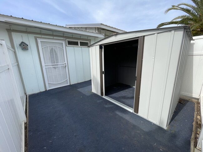 Private fenced front yard with storage shed - 2347 Pio Pico Dr