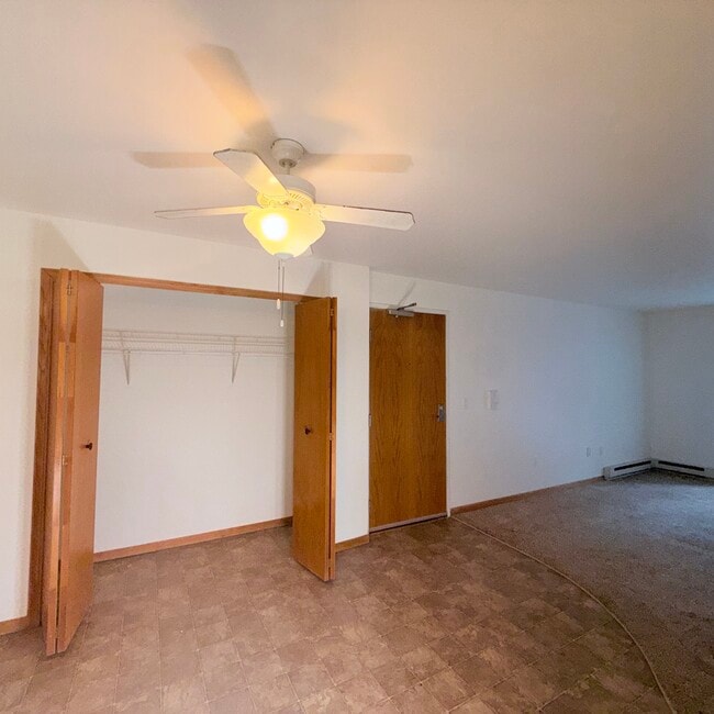 Lower Unit - Large storage closet located in the main living area for added convenience. - Waitlist - Cross Plains Apartments Near Madison | In-Unit Laundry | Walk-In Closets | Trail Access