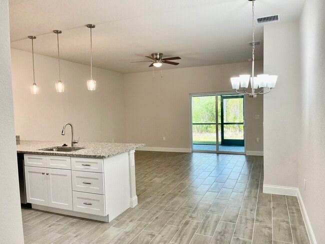 Kitchen. Living and Dining Room - 24487 Zephyr Ct