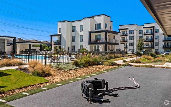Modern Three-Story Apartment Buildings with Pool View at Rhythm Apartments - Rhythm