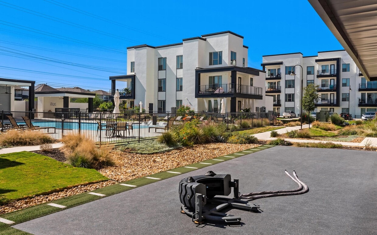 Modern Three-Story Apartment Buildings with Pool View at Rhythm Apartments - Rhythm