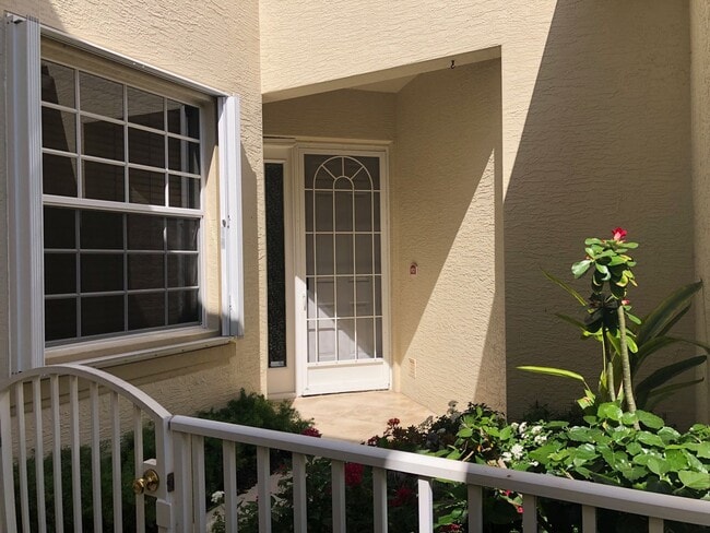 Building Photo - Experience Bell Tower Park. GATED ground floor 2 Bed 2 Bath Den 1 Car Garage Condo.