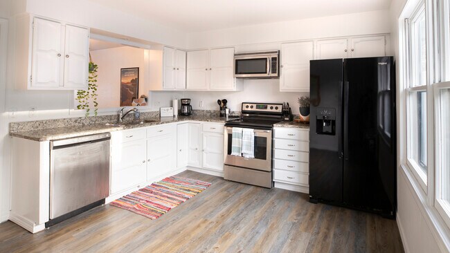 Fully equipped kitchen. Washer & Dryer located just off of this - 1203 Cedar Plz