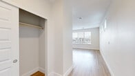 Located at 8425 Old Ski Run Circle in Littleton, Colorado, this studio offers a thoughtfully designed open-concept layout that efficiently combines the kitchen and living areas into one cohesive space. Light hardwood flooring runs throughout, lending warmth and continuity to every corner of the unit.

The kitchen is a standout feature, equipped with stainless steel appliances — including a refrigerator, range, microwave, and dishwasher — complemented by grey shaker-style cabinetry, a white subway tile backsplash, open shelving accents, and a clean white countertop with an undermount sink. Recessed lighting overhead keeps the kitchen bright and functional.

The living area is generously proportioned and bathed in natural light through large windows fitted with blinds, offering views of the surrounding neighborhood. Additional clerestory-style windows along one wall further enhance the brightness of the space. A dedicated closet with a hanging rod provides practical storage within the main living area.

The bathroom is clean and modern, featuring light hardwood-style flooring, a grey vanity with a white countertop, and a glass-enclosed walk-in shower with tiled walls and a pebble floor. Grab bars and ample ventilation round out the thoughtfully appointed design, making this studio a comfortable and functional home in Littleton.